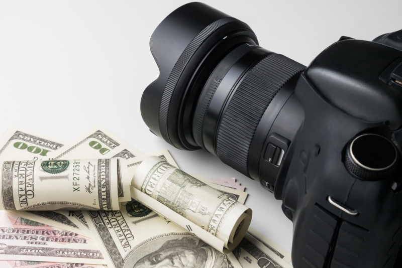 Close-up photography setup featuring film props and replica banknotes
